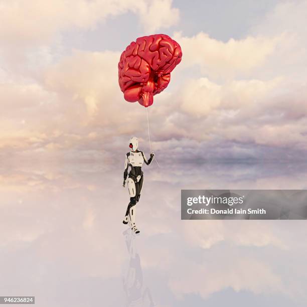 female android holds large floating human brain like balloon on a string - cerebral cortex stock-fotos und bilder