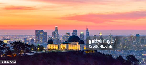 los angeles skyline at dawn panorama and griffith park observatory in the foreground - downtown los angeles aerial stock pictures, royalty-free photos & images
