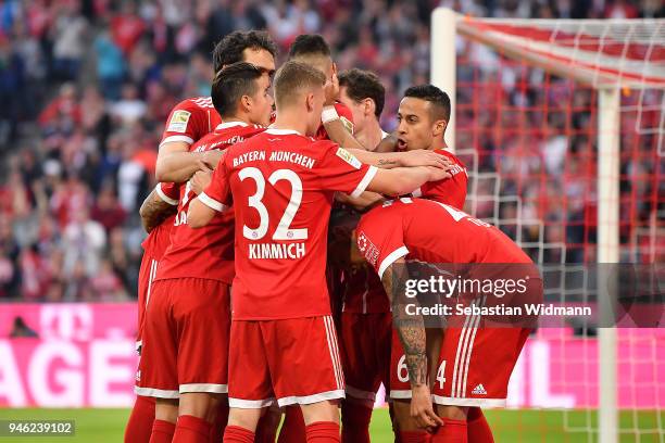 Thiago Alcantara of Bayern Muenchen is celebrates by his team after he scored a goal to make it 3:1 during the Bundesliga match between FC Bayern...