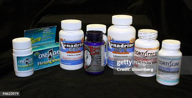 Bottles of Xenadrine EFX, CortiSlim, TrimSPA and One-A-Day WeightSmart diet pills are arranged for a photo at a news conference at Federal Trade...