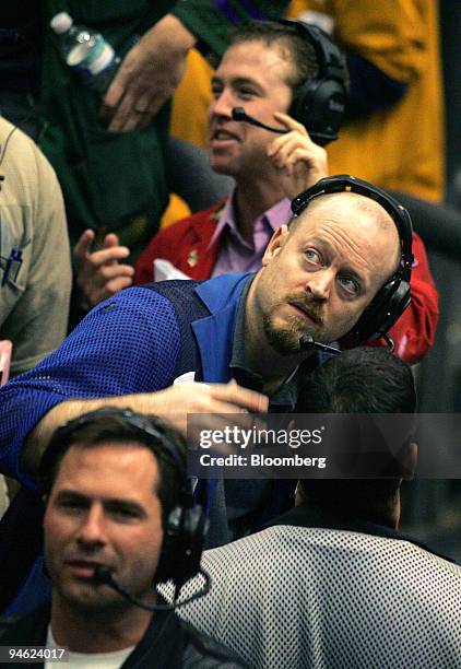 Trader Matthew Garrity, center, works in the Eurodollar Options pit at the Chicago Mercantile Exchange in Chicago, Illinois, U.S., on Friday, Dec....