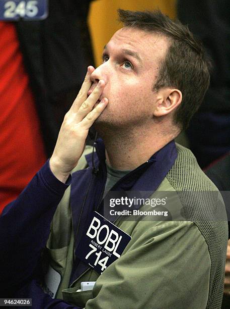 Trader Robert Laude looks up at prices while working in the Eurodollar Options pit at the Chicago Mercantile Exchange in Chicago, Illinois, U.S., on...