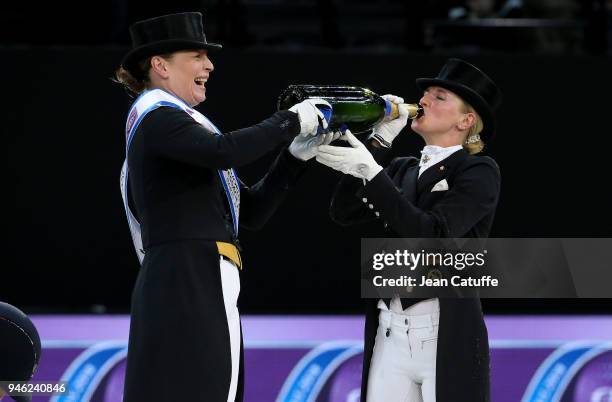 Winner Isabell Werth of Germany , third Jessica von Bredow-Werndl of Germany during the podium ceremony of the FEI World Cup Dressage Final during...