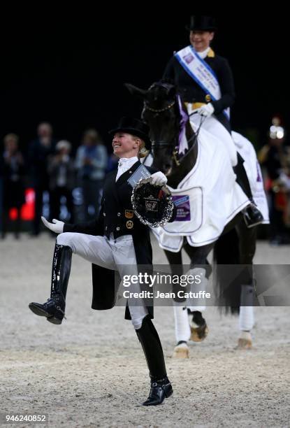 Winner Isabell Werth of Germany , third Jessica von Bredow-Werndl of Germany on foot during the podium ceremony of the FEI World Cup Dressage Final...