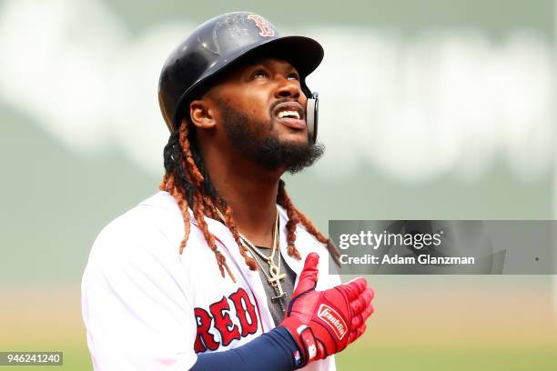 Hanley Ramirez of the Boston Red Sox reacts as he crosses home plate after hitting a two-run home run in the first inning of a game against the...