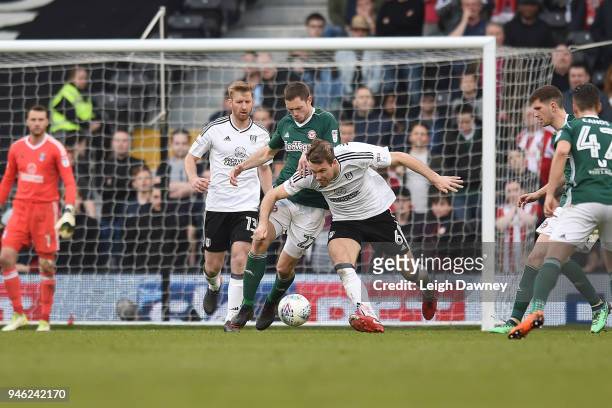 Kevin McDonald of Fulham and Justin Shaibu of Brentford during the Sky Bet Championship match between Fulham and Brentford at Craven Cottage on April...