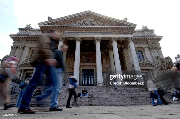 Pedestrians pass the Bourse or stock exchange building housing the Euronext office in Brussels, Belgium, Friday June 2 2006. Deutsche Boerse AG may...