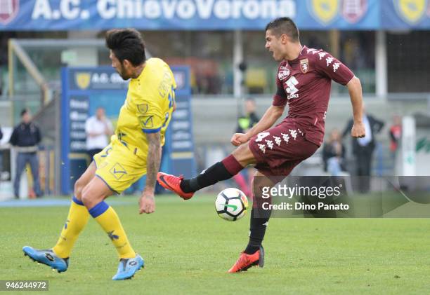 Lucas Castro of Chievo Verona competes with Iago Falque of Torino FC during the serie A match between AC Chievo Verona and Torino FC at Stadio...
