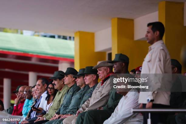 Nicolas Maduro, Venezuela's president, center left, watches members of Venezuela's civilian militia during a military parade at a "Day Of National...