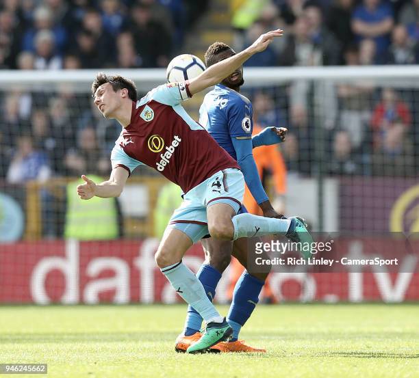 Burnley's Jack Cork vies for possession with Leicester City's Kelechi Iheanacho during the Premier League match between Burnley and Leicester City at...