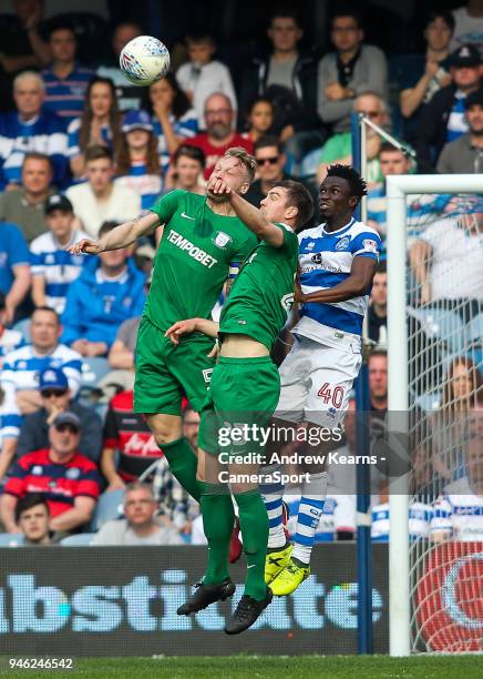 Preston North End's Tom Clarke and Paul Huntington competing with Queens Park Rangers' Chay Tilt during the Sky Bet Championship match between Queens...