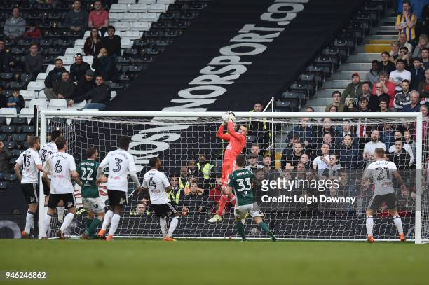 Marcus Bettinelli of Fulham makes a save during the Sky Bet Championship match between Fulham and Brentford at Craven Cottage on April 14, 2018 in...
