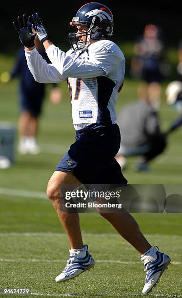 John Lynch, No. 47, safety for the Denver Broncos, prepares to catch a pass during practice at the Denver Broncos Football Club facility in...