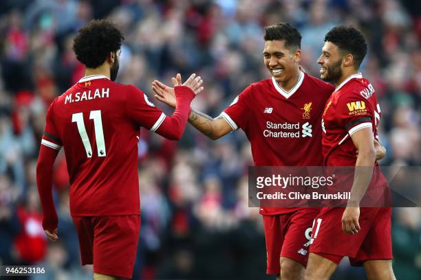 Roberto Firmino of Liverpool celebrates after scoring his sides third goal with Mohamed Salah ofLiverpool and Alex Oxlade-Chamberlain of Liverpool...