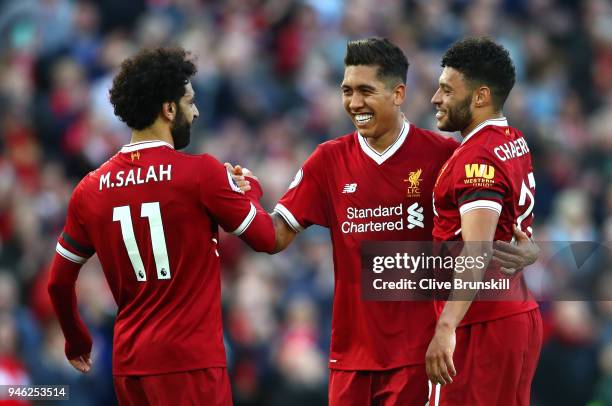 Roberto Firmino of Liverpool celebrates after scoring his sides third goal with Mohamed Salah ofLiverpool and Alex Oxlade-Chamberlain of Liverpool...