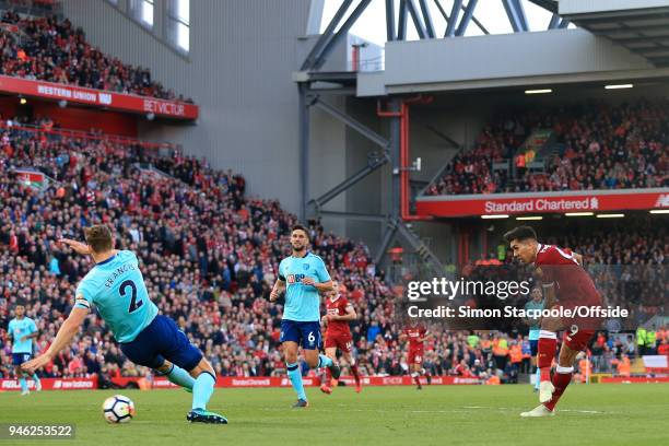 Roberto Firmino of Liverpool scores their 3rd goal during the Premier League match between Liverpool and AFC Bournemouth at Anfield on April 14, 2018...