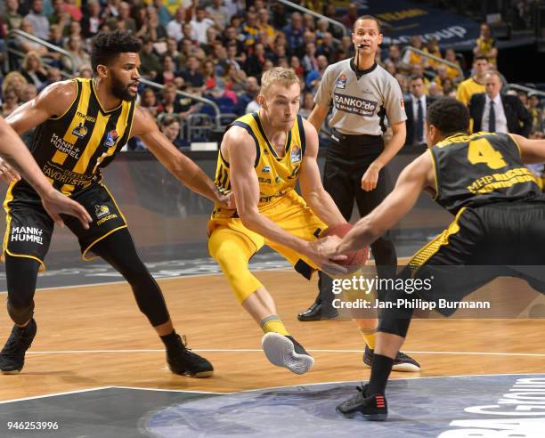 Dwayne Evans of the MHP Riesen Ludwigsburg, Niels Giffey of Alba Berlin and David McCray of the MHP Riesen Ludwigsburg during the Basketball...