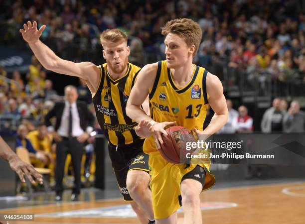 Thomas Walkup of the MHP Riesen Ludwigsburg and Marius Grigonis of Alba Berlin during the Basketball Bundesliga game between Alba Berlin and MHP...