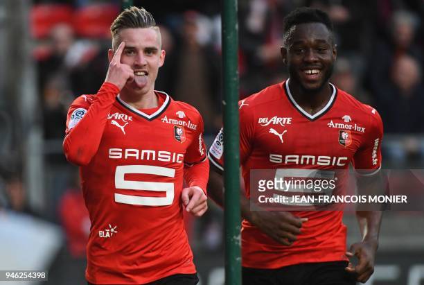 Rennes' French midfielder Benjamin Bourigeaud celebrates with teammate Rennes' French defender Joris Gnagnon after scoring a goal during the French...
