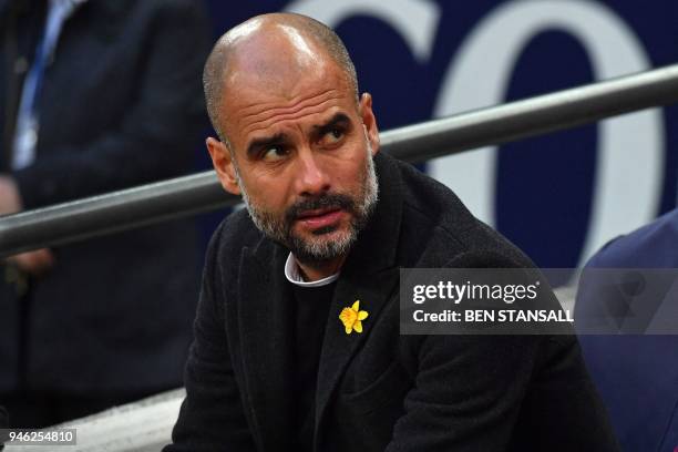 Manchester City's Spanish manager Pep Guardiola awaits kick off in the English Premier League football match between Tottenham Hotspur and Manchester...