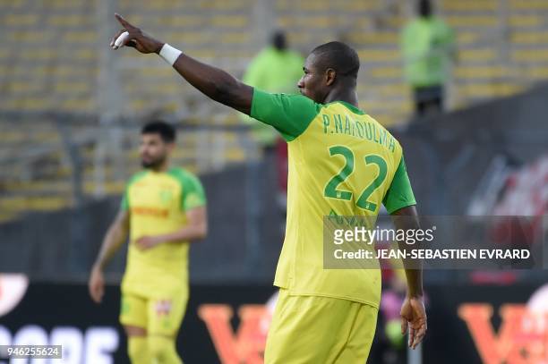 Nantes' Burkinabe forward Prejuce Nakoulma celebrates after scoring a goal during the French L1 football match between Nantes and Dijon on April 14...