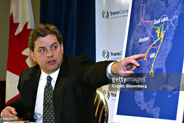 Harold Kvisle, president and chief executive officer of TransCanada Corp., points to a map of the United States while answering questions during the...