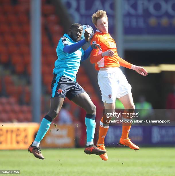 Blackpool's Sean Longstaff jumps with Fleetwood Town's Toumani Diagouraga during the Sky Bet League One match between Blackpool and Fleetwood Town at...