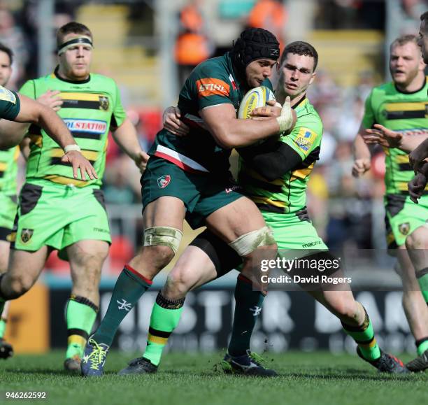 Sione Kalamafoni of Leicester is tackled by George North during the Aviva Premiership match between Leicester Tigers and Northampton Saints at...