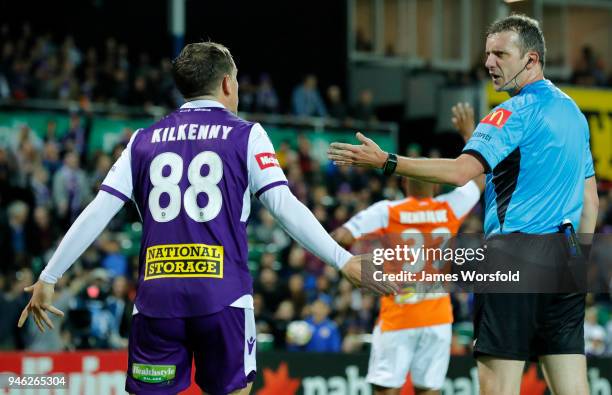 Referee Peter Green talks to Neil Kilkenny of the Perth Glory during the round 27 A-League match between the Perth Glory and the Brisbane Roar at nib...