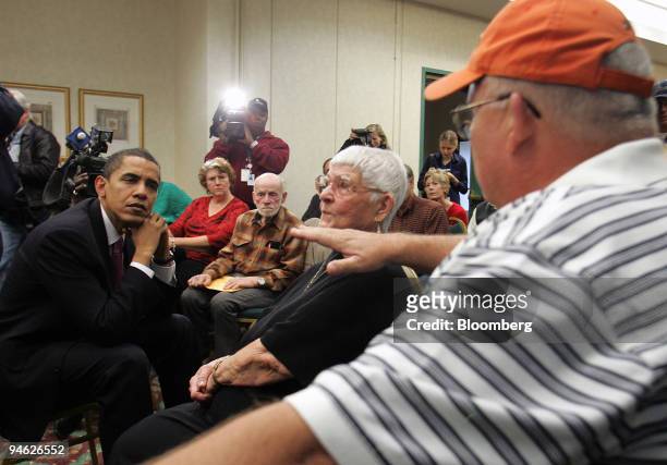 Senator Barack Obama, left, listens to workers of two Illinois nuclear plants that say they were affected by nuclear waste, prior to testifying in...