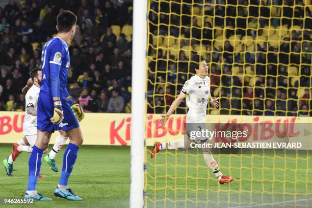 Dijon's South Korean midfielder Chang Hoon Kwon celebrates after scoring a goal during the French L1 football match between Nantes and Dijon on April...