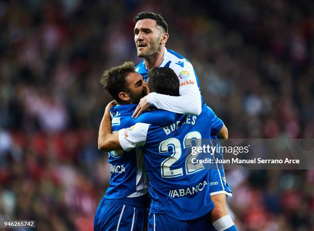 Adrian Lopezof RC Deportivo La Coruna celebrates with his teammates Celso Borges and Lucas Perez of RC Deportivo La Coruna after scoring his team's...