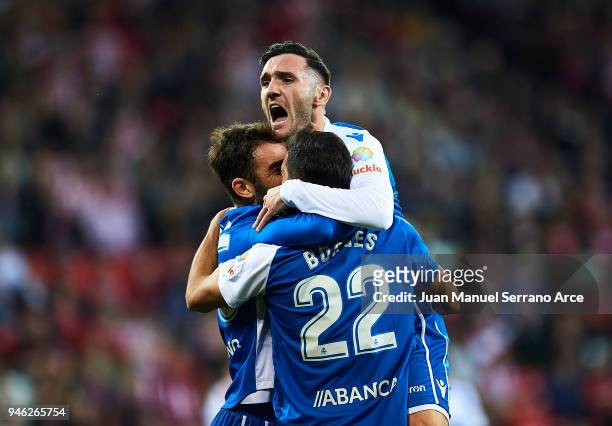 Adrian Lopezof RC Deportivo La Coruna celebrates with his teammates Celso Borges and Lucas Perez of RC Deportivo La Coruna after scoring his team's...