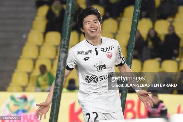 Dijon's South-Korean midfielder Chang Hoon Kwon celebrates after scoring during the French L1 football match between Nantes and Dijon on April 14,...