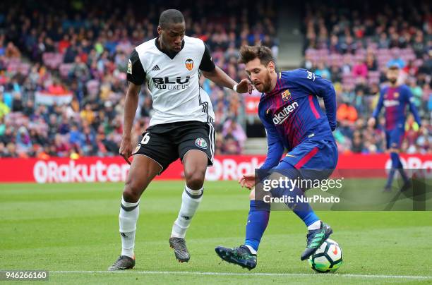 Geoffrey Kondogbia and Leo Messi during the match between FC Barcelona and Valencia CF, played at the Camp Nou Stadium on 14th April 2018 in...