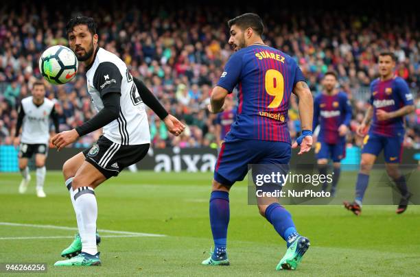 Luis Suarez and Ezequiel Garay during the match between FC Barcelona and Valencia CF, played at the Camp Nou Stadium on 14th April 2018 in Barcelona,...