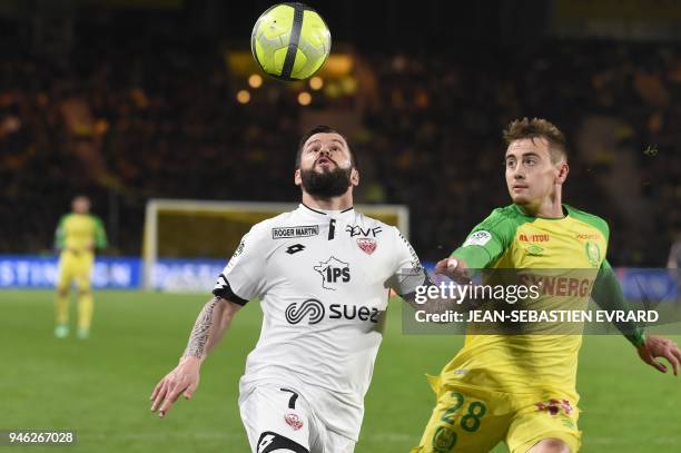 Dijon's French midfielder Frederic Sammaritano vies with Nantes' French midfielder Valentin Rongier during the French L1 football match between...