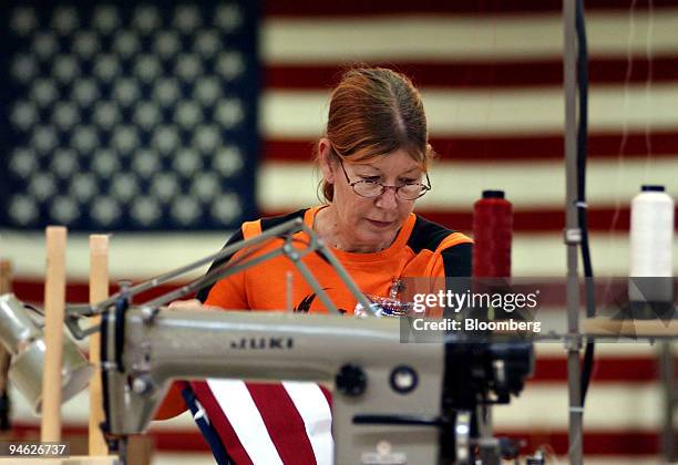 Worker Cheryl Hammersley sews an American flag at the Annin Company in Coshocton, Ohio, U.S., Wednesday, Dec. 26 , 2007. Annin Company is the largest...
