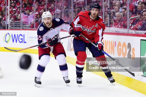 Brooks Orpik of the Washington Capitals and Mark Letestu of the Columbus Blue Jackets battle for the puck in the second period in Game One of the...