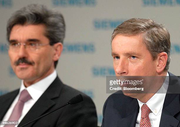 Siemens Chief Executive Klaus Kleinfeld, right, speaks as Siemens Chief Financial Officer Joe Kraemer listens at the company's press conference in...