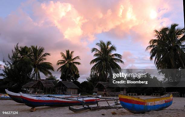 Dugout canoes sit on the beach in Foulepointe, Madagascar, Tuesday, May 30, 2006.