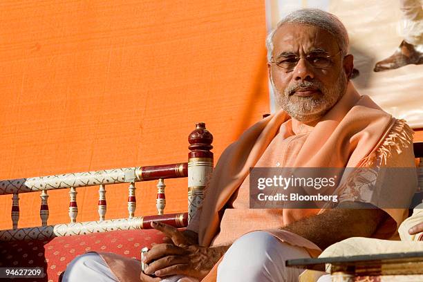 Narendra Modi, chief minister of Gujarat State, waits for his turn to speak at a rally in Ahmadabad, Gujarat, India, on Sunday, Dec. 23, 2007....