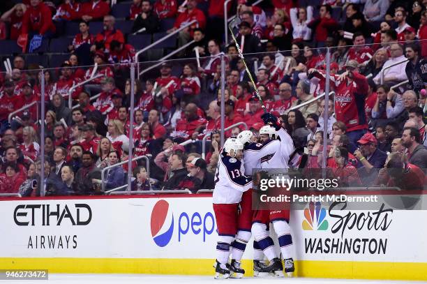 Seth Jones of the Columbus Blue Jackets celebrates with his teammates after scoring a third period goal against the Washington Capitals in Game One...