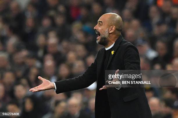 Manchester City's Spanish manager Pep Guardiola gestures on the touchline during the English Premier League football match between Tottenham Hotspur...