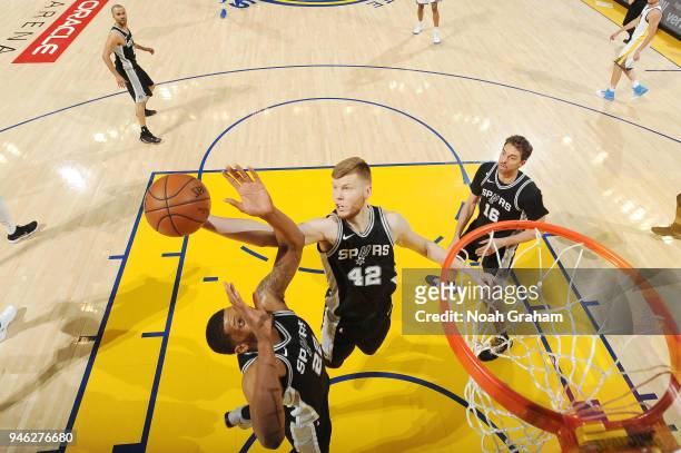 Davis Bertans of the San Antonio Spurs grabs the rebound against the Golden State Warriors in Game One of Round One of the 2018 NBA Playoffs on April...