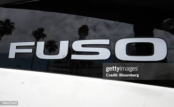 Sign for Mitsubishi Fuso Truck & Bus Corp. Is seen on an Aero Queen Super Hi Decker Bus in Tokyo, Japan, on Friday, June 15, 2007. Mitsubishi Fuso...