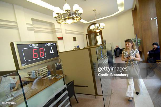 Customer approaches the counter at a Ceska Pojistovna branch in Prague, Czech Republic, Wednesday, April 25, 2006. Assicurazioni Generali SpA,...