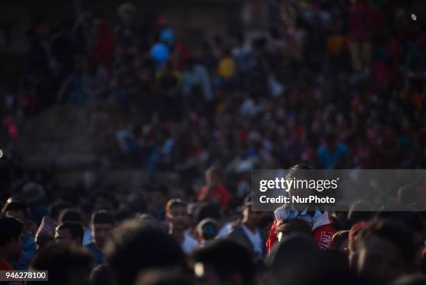 Father carry his son to observe festival during the celebration of Bisket Jatra Festival at Bhaktapur, Nepal on Saturday, April 14, 2018. The Bisket...