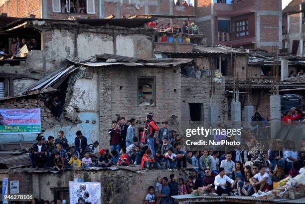 Thousands of Nepalese devotees gather to observe the pull down 'Linga' a wodden pole during the celebration of Bisket Jatra Festival at Bhaktapur,...