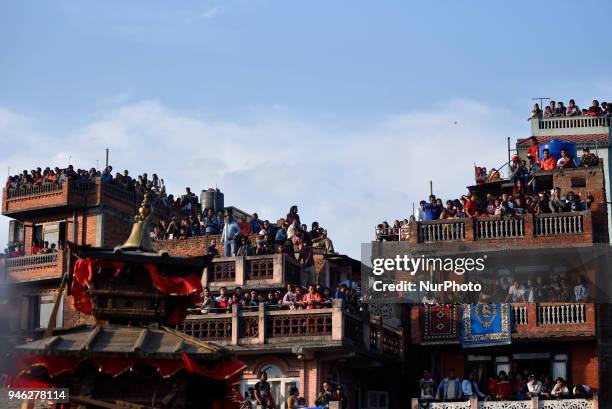 Thousands of Nepalese devotees gather to observe the pull down 'Linga' a wodden pole during the celebration of Bisket Jatra Festival at Bhaktapur,...